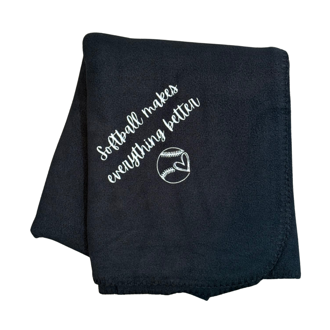 Black blanket with white text and softball graphic in white