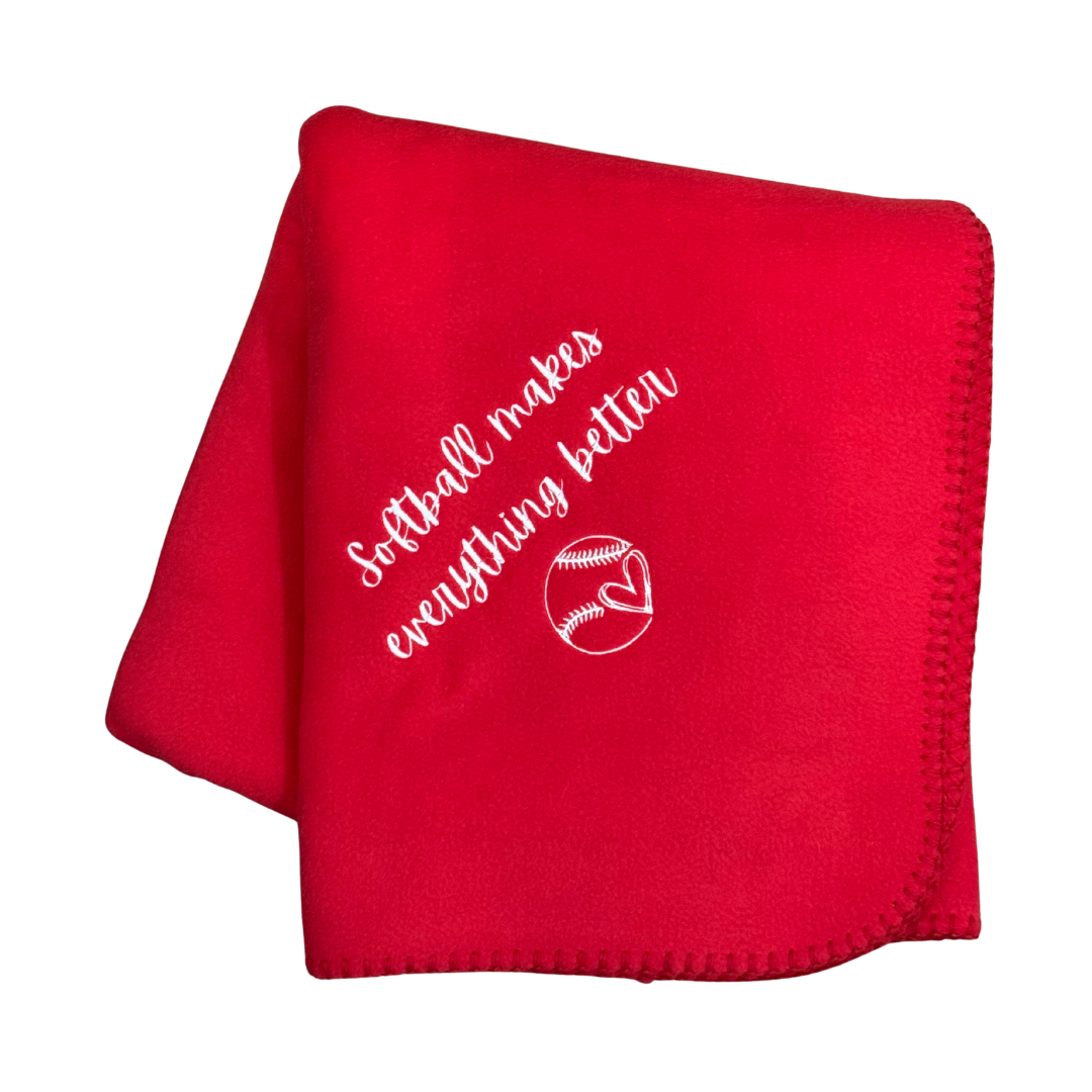 Red blanket with white text and baseball graphic