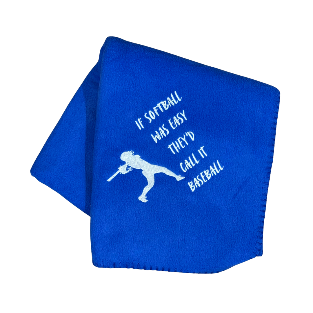 Blue blanket with white text and silhouette of a softball player