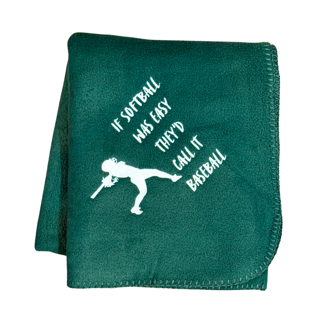 Green blanket with white text and softball player graphic