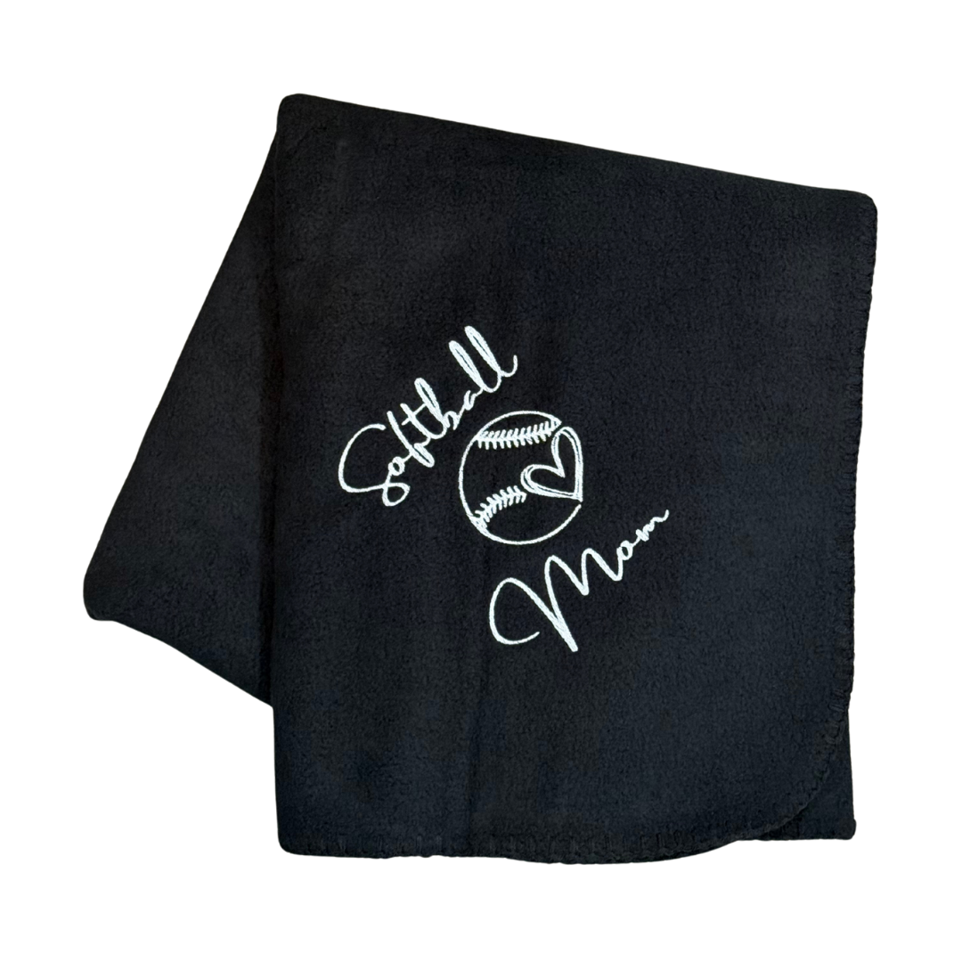 Black blanket with 'Softball Mom' text and design in white embroidery