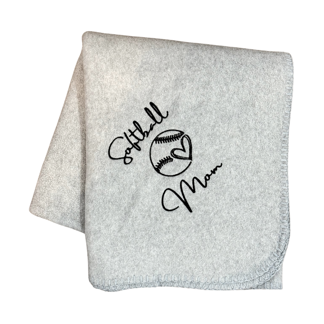 Gray blanket with 'Softball Mom' text and softball graphic in black embroidery