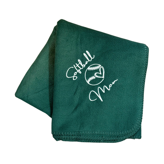Green blanket with 'Softball Mom' text and design in white stitching