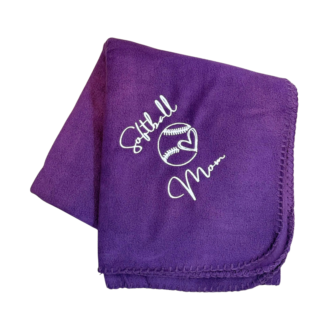 Purple blanket with 'Softball Mom' text and design in white embroidery