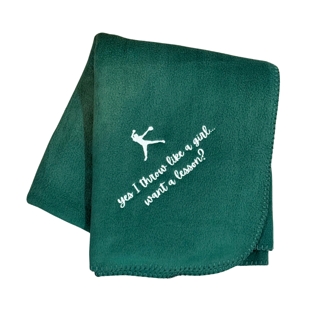 Green blanket with white text and logo