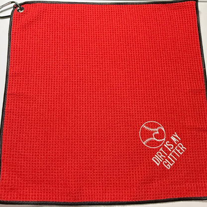 Red towel with 'Dirt is My Glitter' logo embroidered in white thread