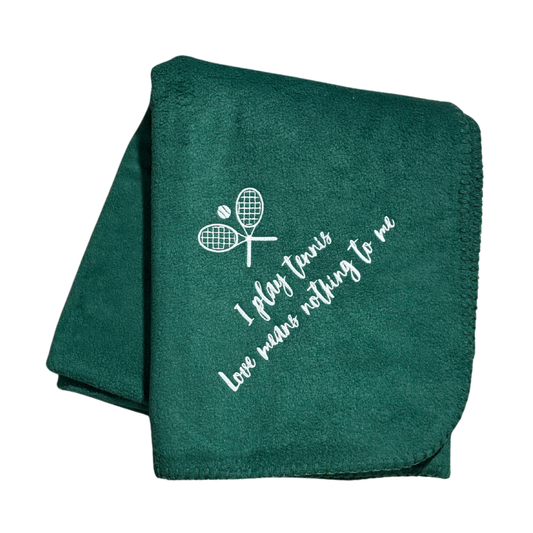 green tennis fleece blanket with white text and racket design