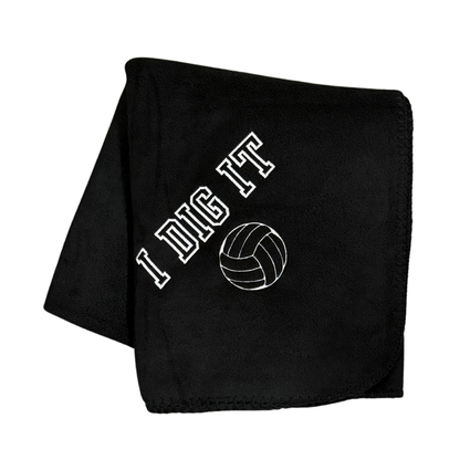 black fleece blanket with I Dig It and a volleyball embroidered in white thread
