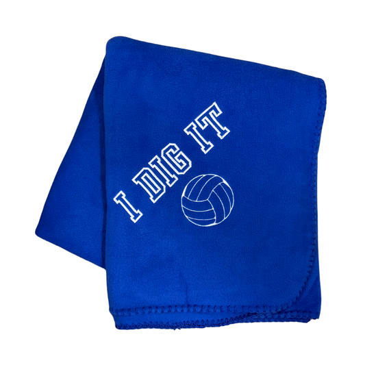 blue fleece blanket with I Dig It and a volleyball embroidered in white thread
