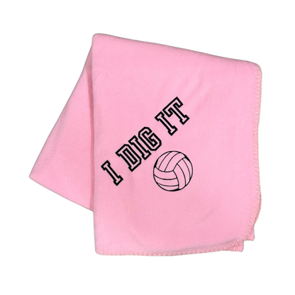 pink fleece blanket with I Dig It and a volleyball embroidered in black thread