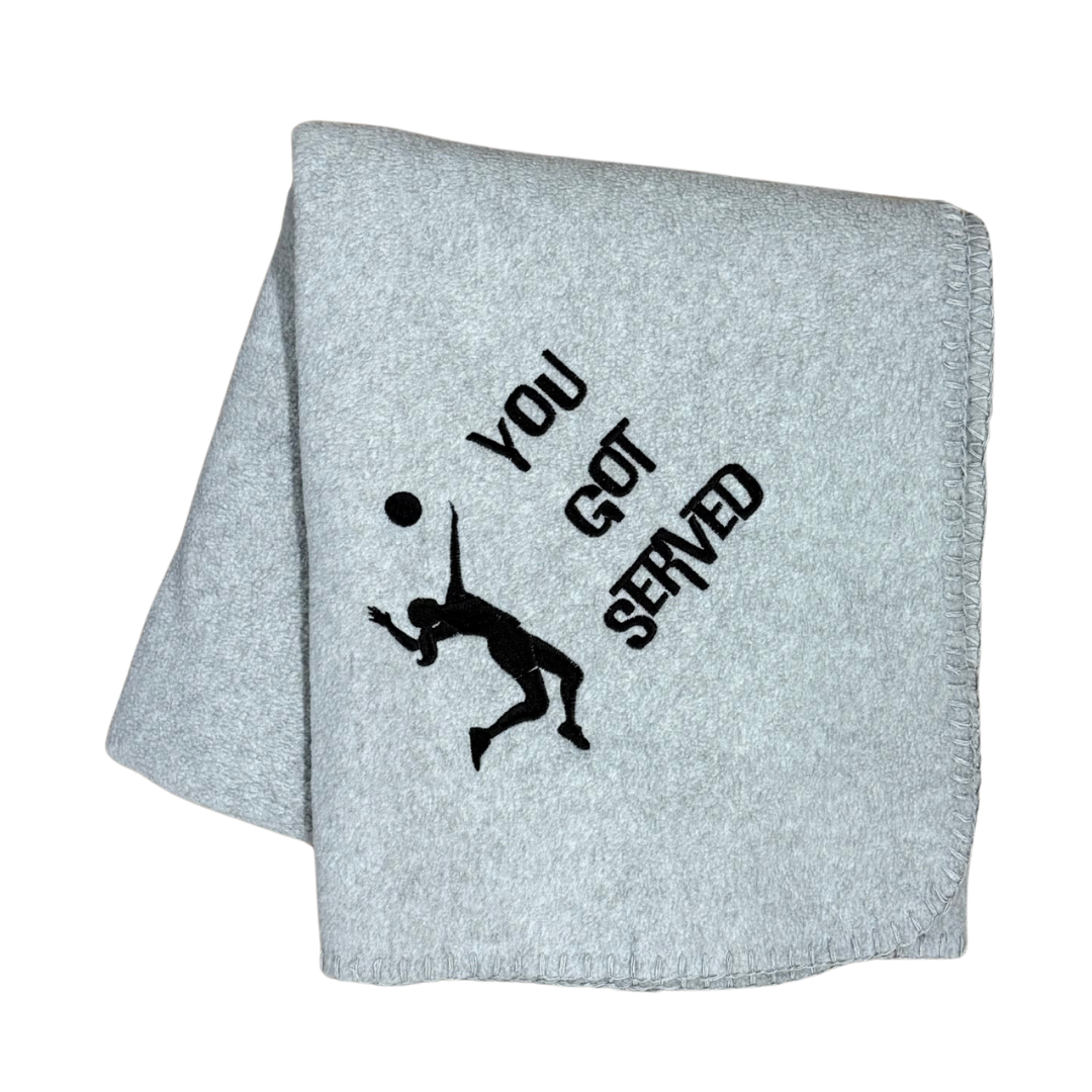 gray fleece blanket with You got served and a volleyball girl in black  embroidery