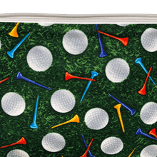 Load image into Gallery viewer, golf bag with green grass background and white golf balls with blue, red, and yellow golf tees
