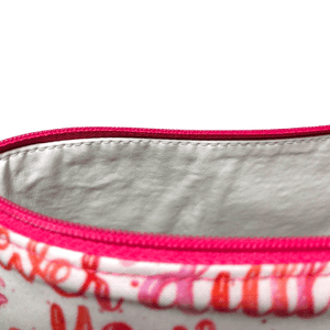 makeup bag with hot pink zipper and white lining