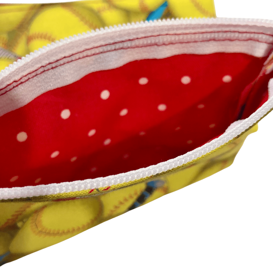 inside red polka dot lining of softball coin purse
