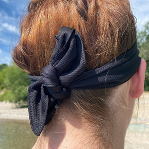 back of tie headband tied in a double knot