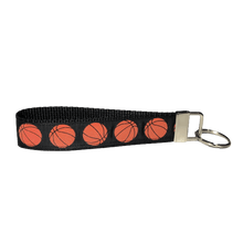 Load image into Gallery viewer, black basketball keychain with orange glittery basketballs
