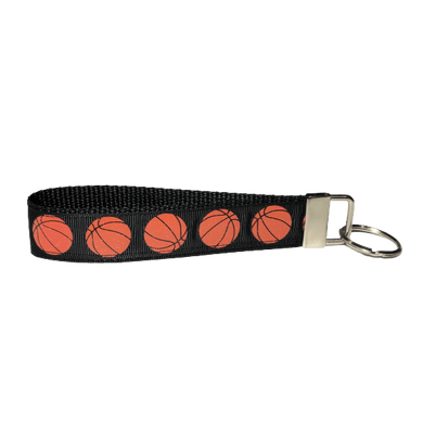black basketball keychain with orange glittery basketballs
