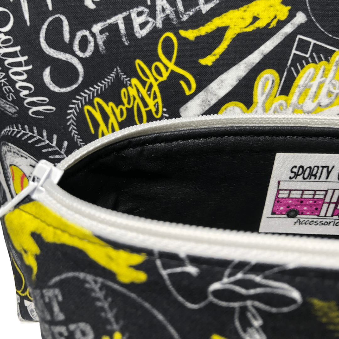 black lining of softball makeup bag and white zipper