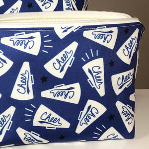 blue cheer makeup bag with white zipper