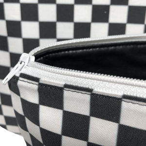 white zipper on black and white checkered pouch with black lining