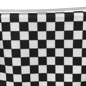 white zipper on checkerboard cosmetic bag