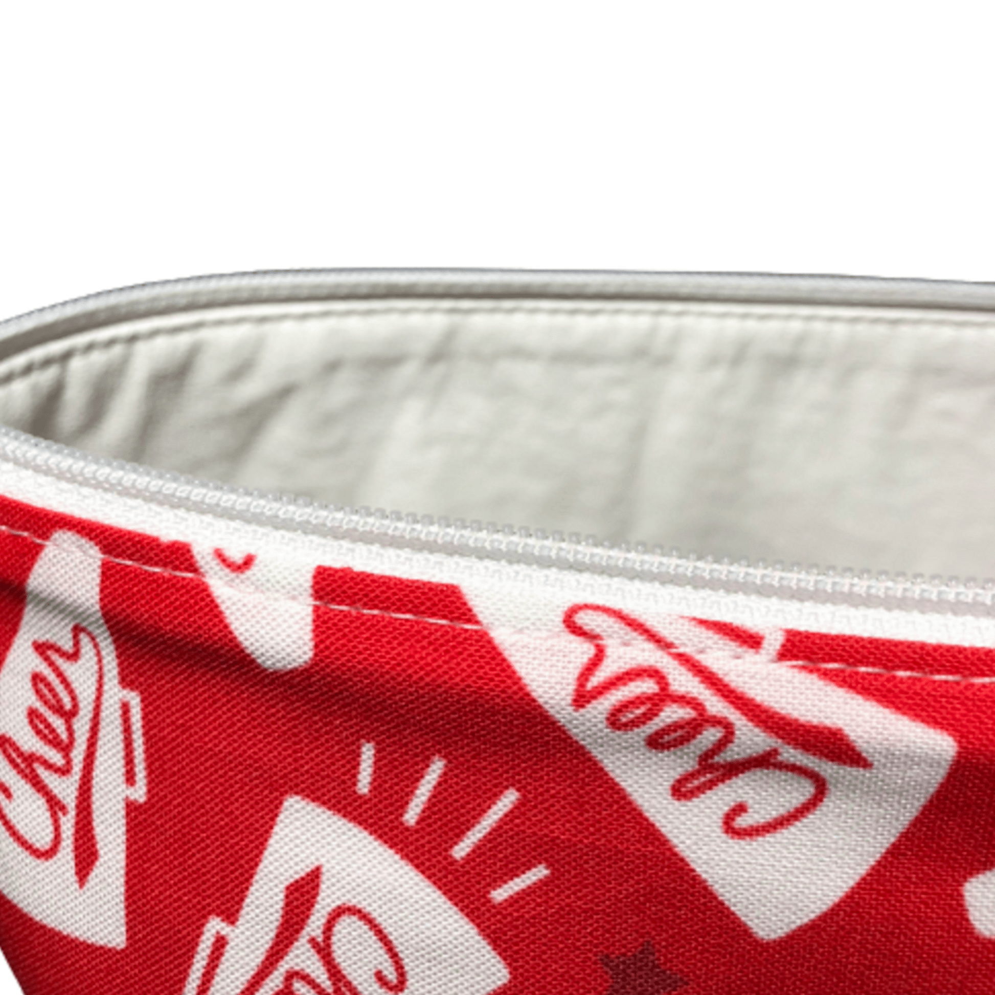 white vinyl lining and white zipper on red cheer cosmetic bag