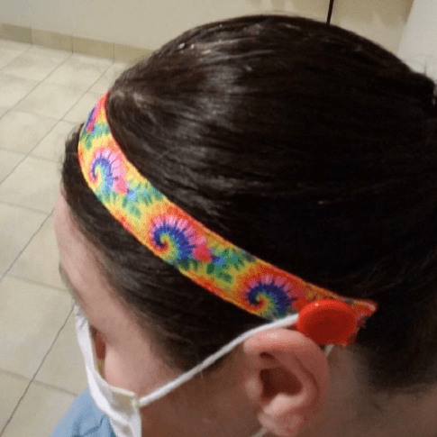 headband with buttons to hold mask straps