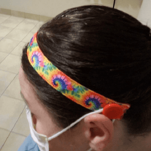 headband with buttons to hold mask straps