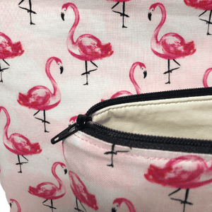 pink flaming bag black zipper and cream vinyl lining