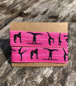 hot pink gymnastics sleeve clips with black gymnast silhouettes