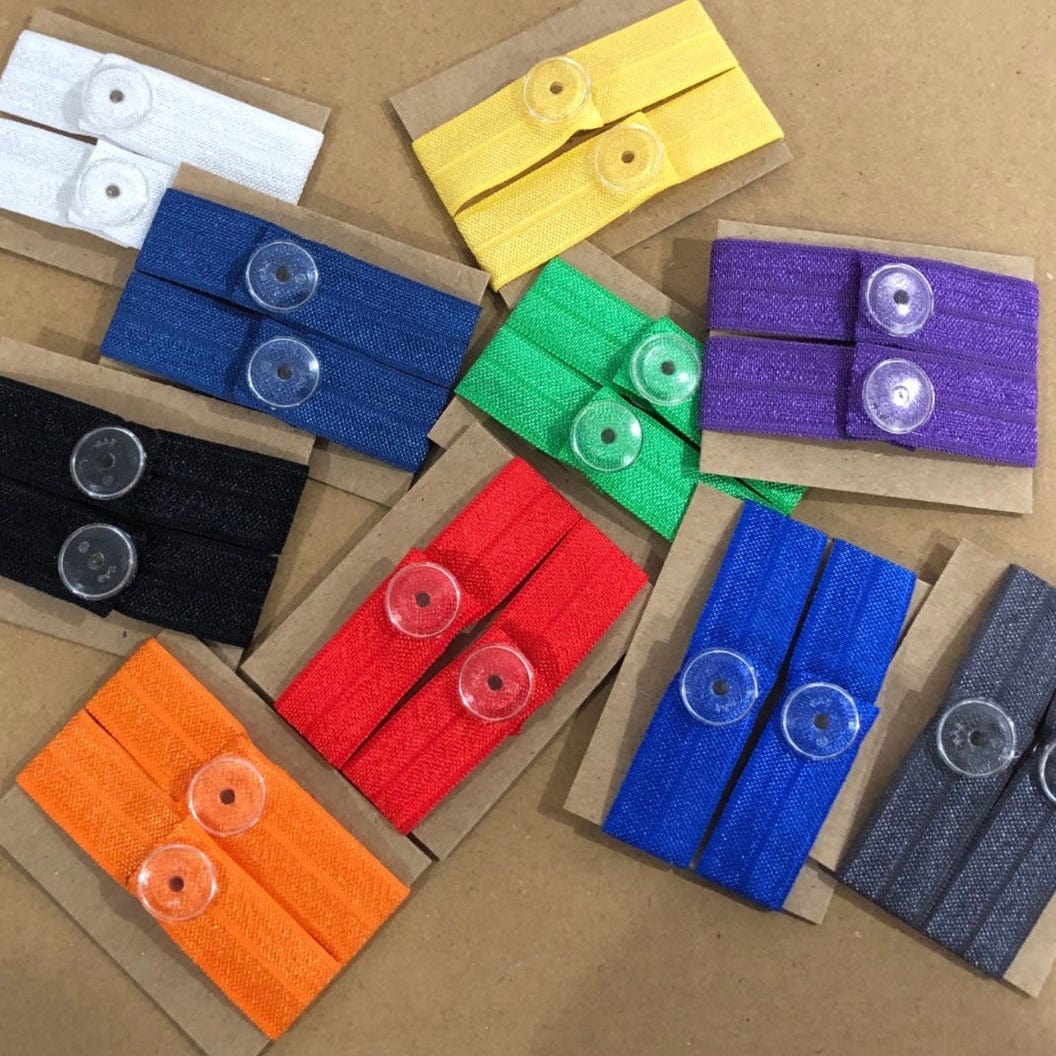 solid colored sleeve clips in white, yellow, navy blue, green, purple, black , red, royal blue, gray, and orange