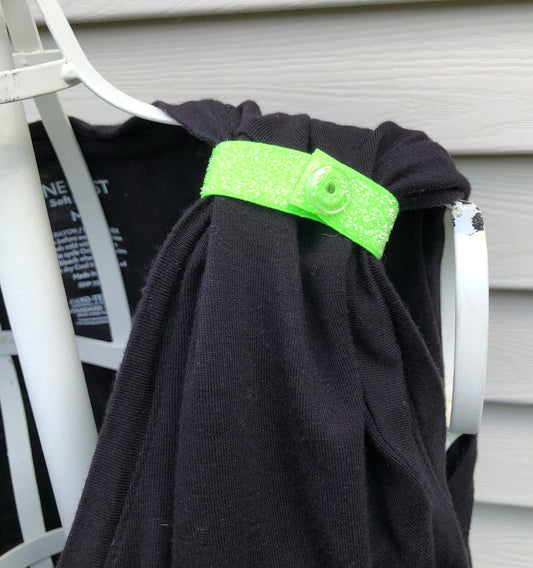 neon green glittery sleeve clip on black tshirt