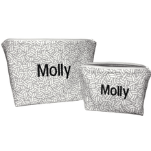 Load image into Gallery viewer, one large and one small zippered bag with volleyball patterened fabric, name Molly in black at center, and white zippers

