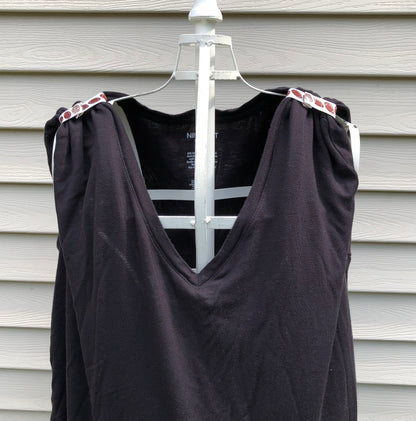 pair of football sleeve clips on black tshirt turning it into a tank top