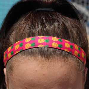 pink pineapple headband on a brunette model