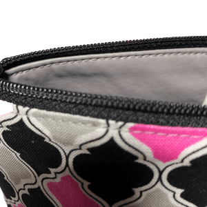 black zipper and gray lining of pink and black cosmetic bag