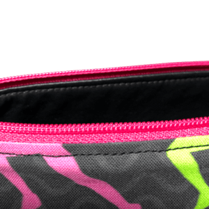 interior look of zippered bag showing black vinyl lining and hot pink zipper