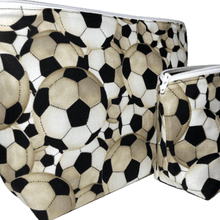 Load image into Gallery viewer, side view of small cippered bag with soccer balls on it and boxed out bottom of bag
