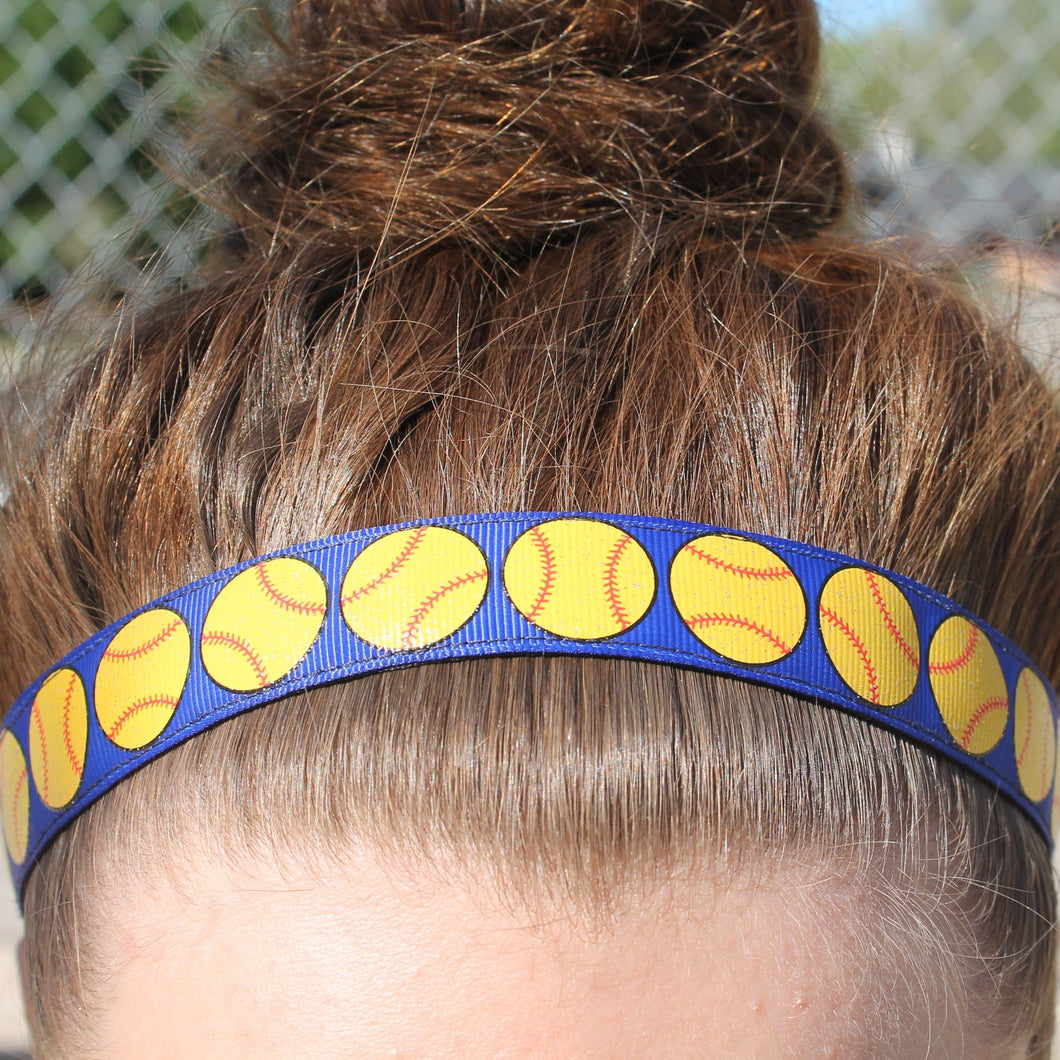 blue softball headband on girl with hair in a bun