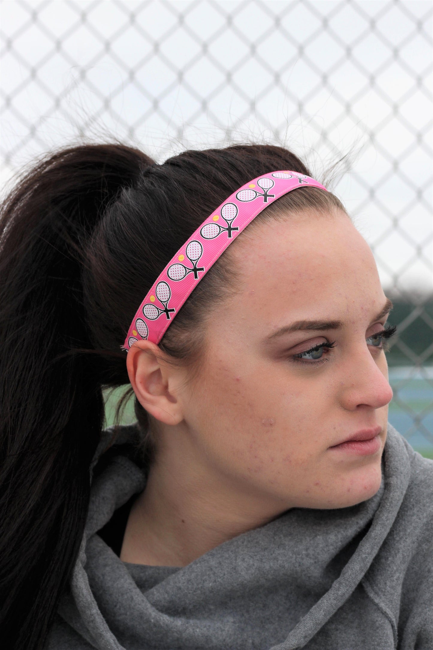 pink tennis headband on model side view