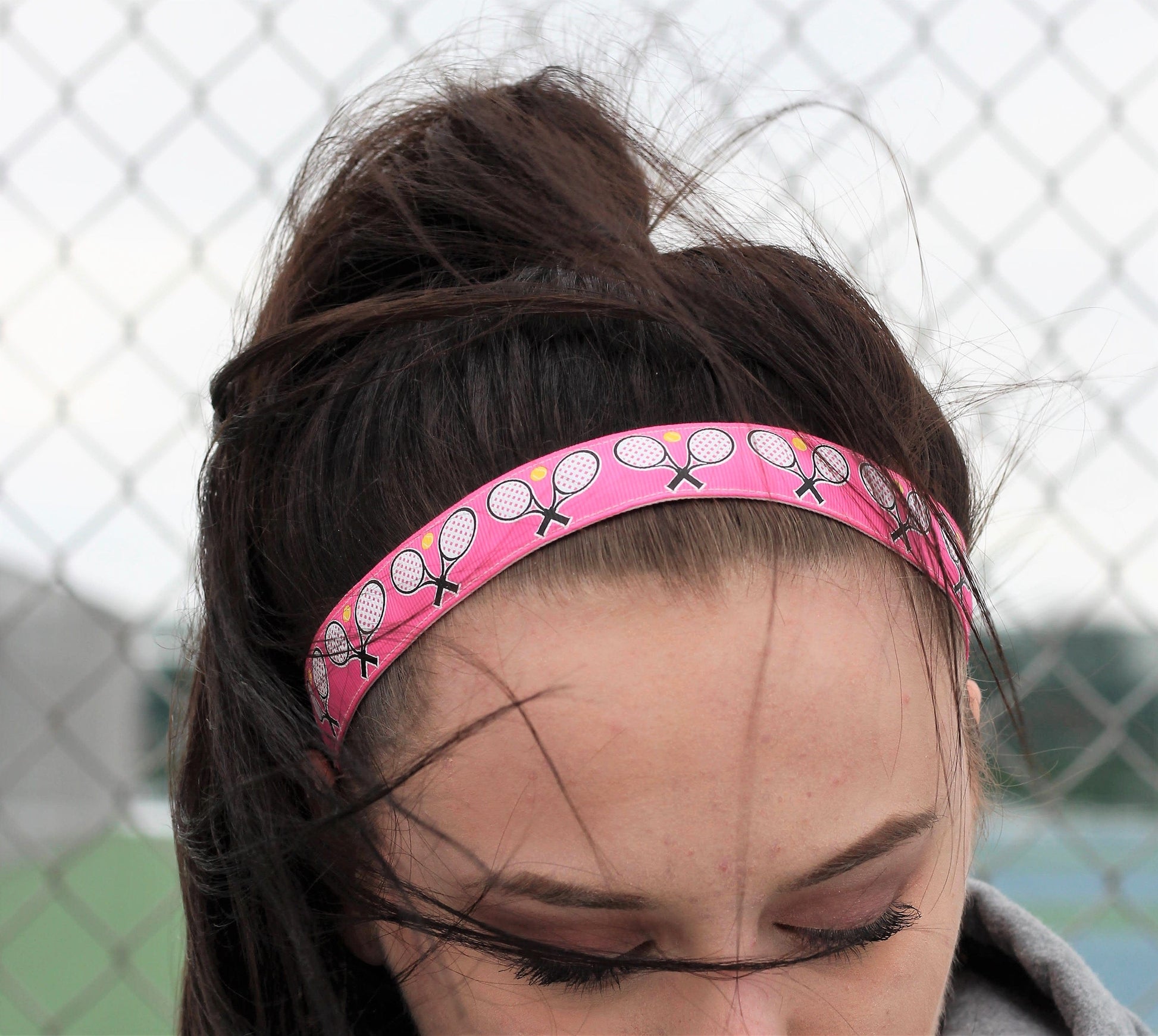 pink tennis headband on model front view