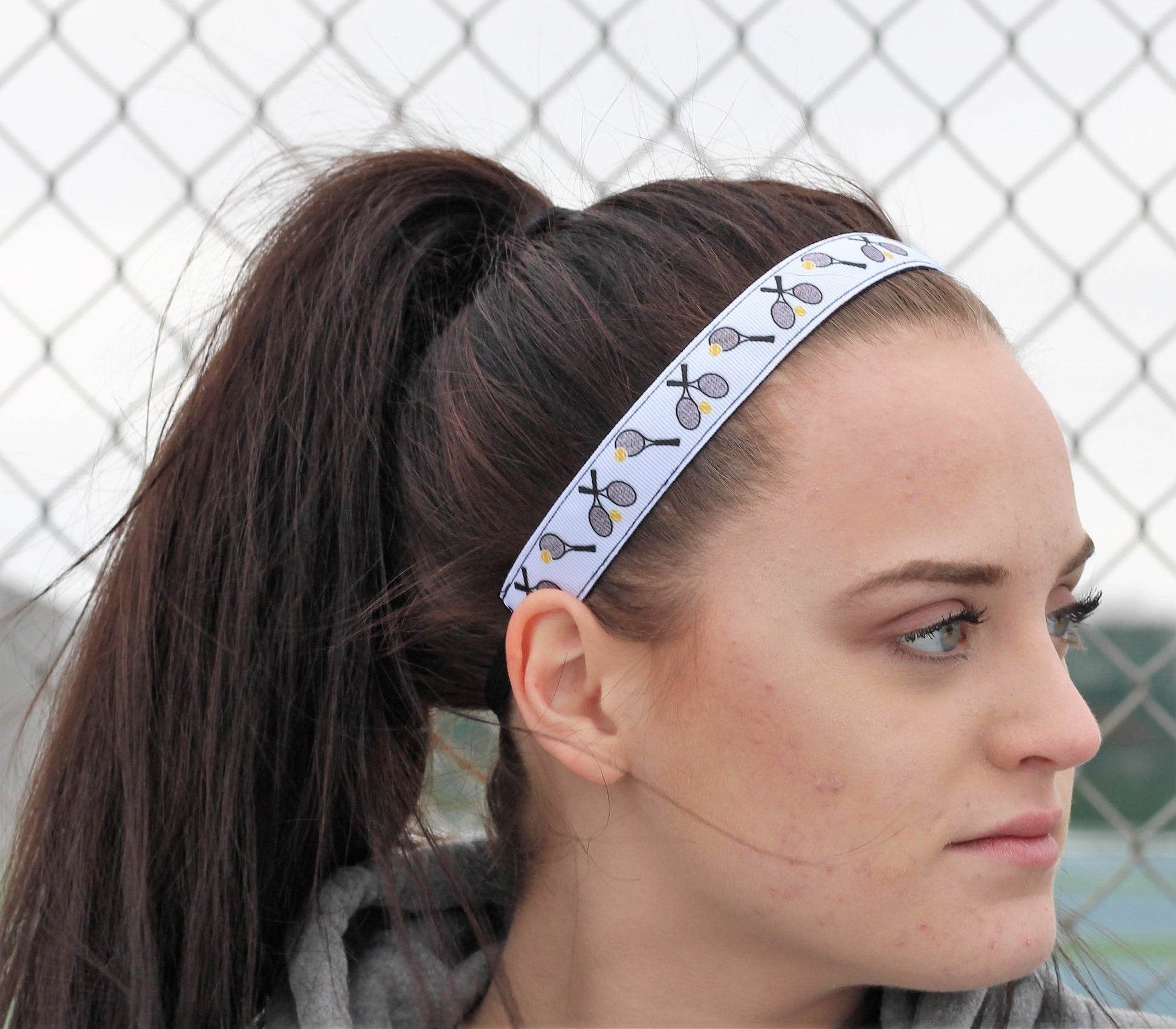 white tennis headband on medel side view