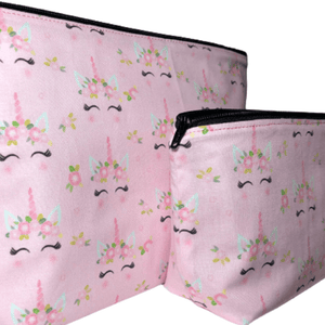 side of pink unicorn makeup bag with black zipper